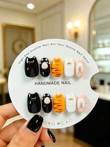 10pcs Handmade Short Almond Shaped Wearable Press-On Nails, Black And Orange Color Scheme, Japanese Cat Theme. Featuring "Cat Ear Notch" Design, Hand-Painted Red-Brown Tiger Stripes And White French Lines, Decorated With Gold Accessories. Cute Style, Suitable For Girls, Perfect For Parties, Weddings And Daily Occasions, Comes With Tool Kit. - Orange - View 10
