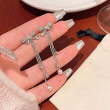 1 par de pendientes elegantes y sencillos con diseño de lazo y borla, de acero inoxidable con forma de gota de agua, combinados con borlas de perlas de imitación, estilo para mujer - hipoalergénicos - 1 par de pendientes con borlas y lazo - Ver 7
