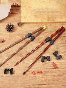 2/3/5/10/20 piezas Soporte de palillos de plástico, dispositivo de ayuda para palillos de unicolor reutilizable, herramienta de entrenamiento para principiantes, adecuado para todas las edades, accesorios de cocina reutilizables, ayuda a dominar el uso de palillos, herramientas de servicio de catering - Negro - Ver 5