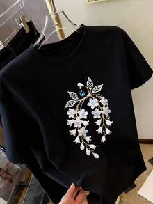 Camiseta casual de mujer, camiseta con estampado de lirio de la valle con perlas y diamantes azules, estilo fresco y elegante, regalo, top casual de cuello redondo, transpirable. - Negro - Ver 1