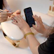 U-Shaped Manicure Hand Rest With Butterfly Metal Legs, Phone Holder, And Light Luxury PU Hand Cushion - White - View 1