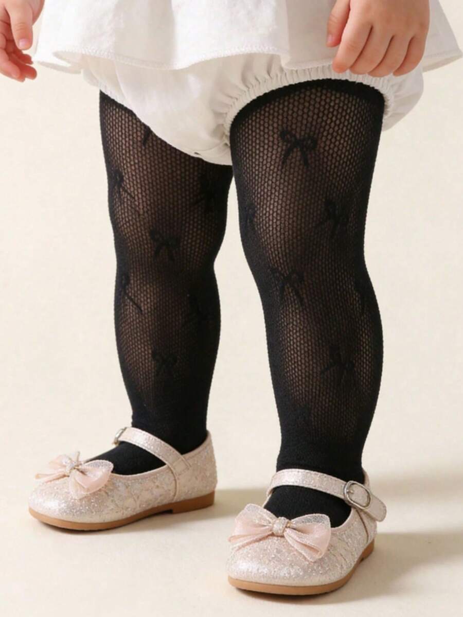 1件女嬰蝴蝶結網格褲襪，透氣鏤空緊身褲