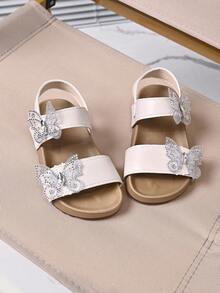 1 par de sandalias planas de niña con decoración de mariposa de strass brillante, punta abierta, correa de tobillo ajustable con cierre de gancho y bucle, suela blanda antideslizante, estilo princesa casual de verano para playa, adecuadas para salidas diarias - Rosa Pálido - Ver 3