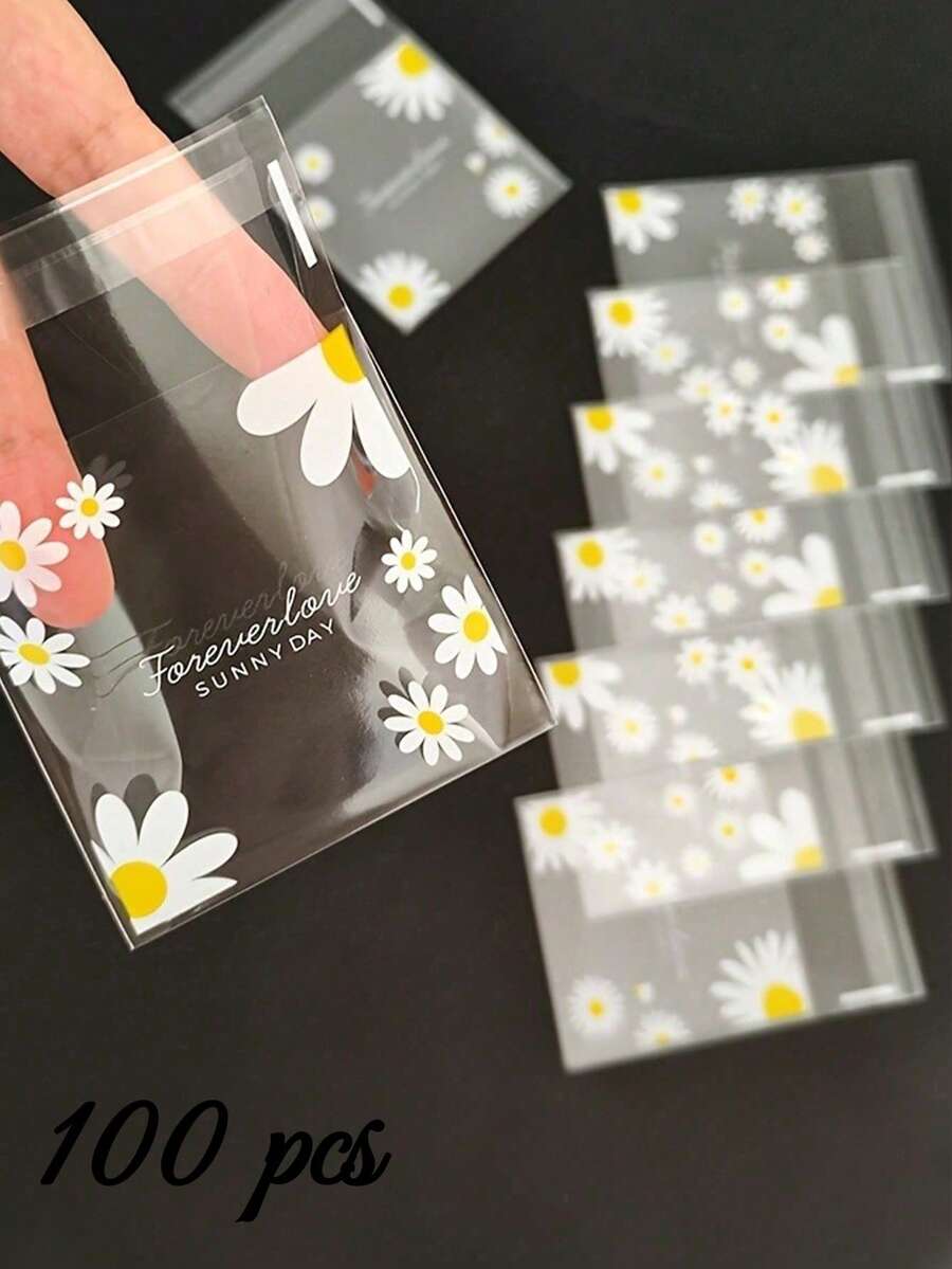 100pcs Daisy Pattern Gift Bags, Transparent Self-Adhesive Small Packaging Bags, Cute Fresh Daisy Pattern Gift Packaging Self-Sealing Bags, Suitable For Wedding Gifts, Birthday Tea Party, Small Gift Packaging - View 1
