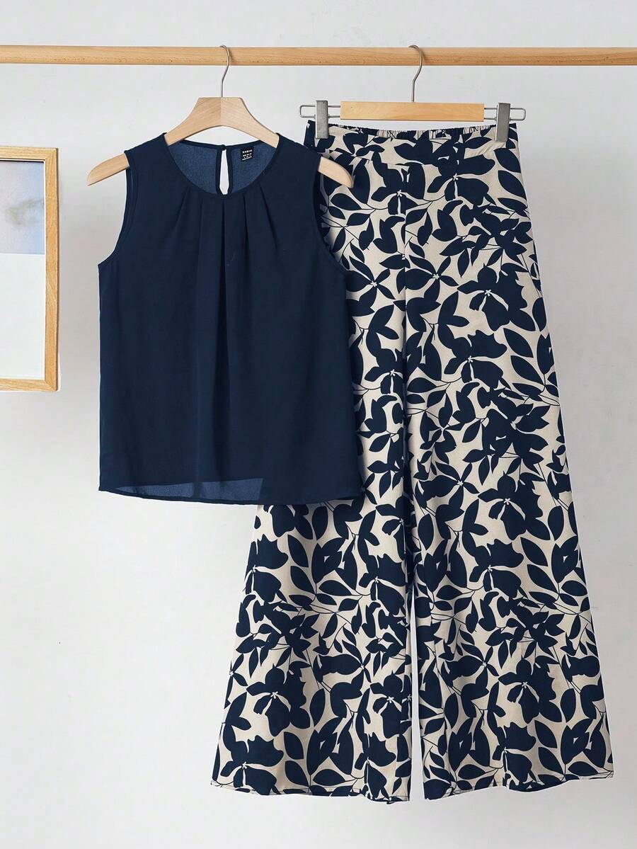 de dos piezas de verano para mujer, compuesto por un chaleco negro con cuello y plisado elegante y pantalones elásticos estampados con flores, adecuado para usar en varias ocasiones - Azul marino - Ver 1