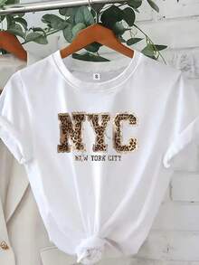 Camiseta gráfica de la ciudad de Nueva York - Camiseta casual blanca de cuello redondo con estampado de leopardo y letras doradas, perfecta para atuendos casuales, ropa casual |   Camiseta g - Negro - Ver 1