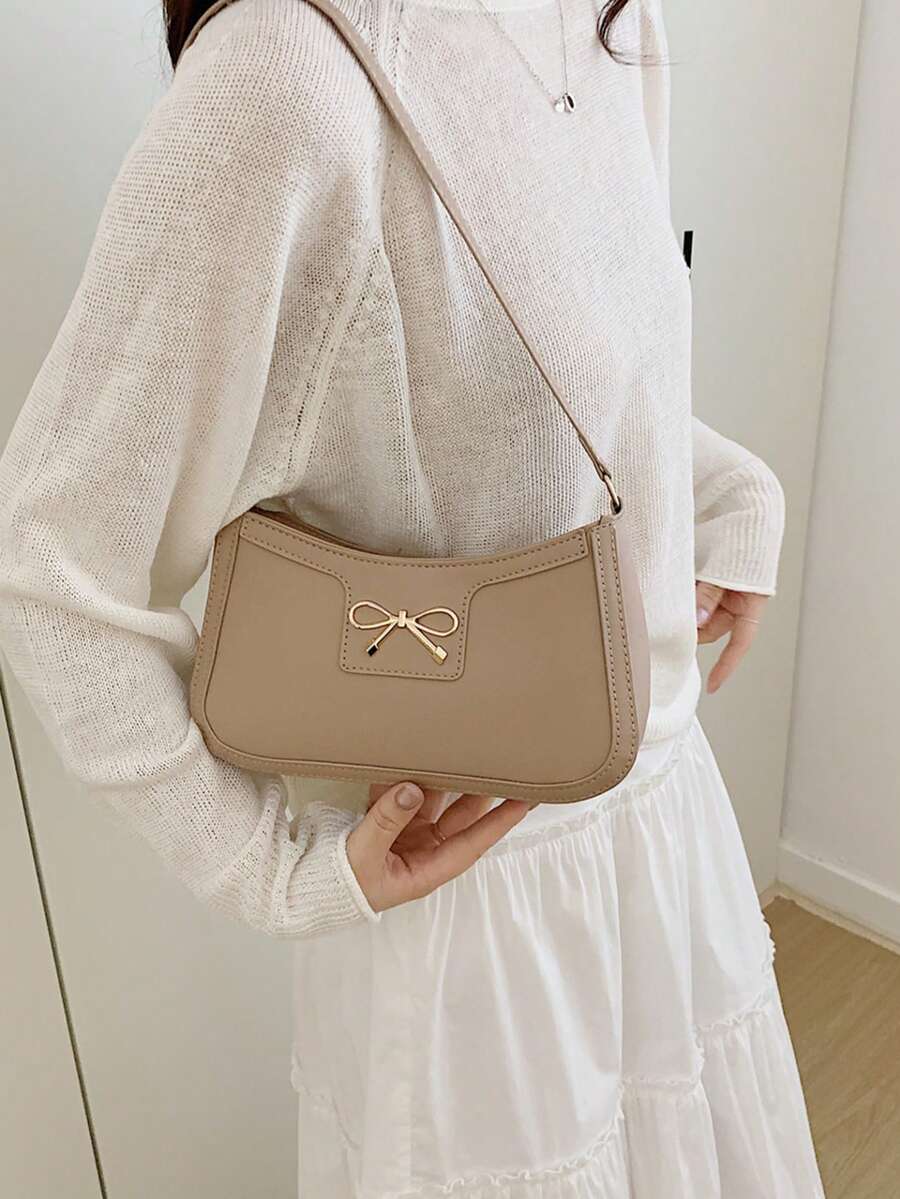 Túi đựng mỹ phẩm/tiền xu kẹp nách nữ thời trang casual mới, chất liệu PU màu trơn đen/cà phê/khaki, đính nơ và phụ kiện kim loại