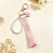 1pc Sakura Keychain, Zinc Alloy Keychain Rope, Jacquard Woven Strap Keychain, Handbag Pendant Keychain Accessory, Wrist Strap Keychain, Printed Strap Keychain, Women's Car Keychain, Women's Fashion Keychain, Women's Handbag Pendant Universal Keychain - Multicolor - View 1