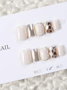10 miếng móng tay giả dán ngắn hình oval làm thủ công, móng acrylic màu trắng sữa & vàng champagne, phong cách nhẹ nhàng sang trọng, trang trí lá vàng kim tuyến, phối màu tối giản, có thể tái sử dụng, phù hợp cho hàng ngày, tiệc tùng & lễ hội, mọi mùa, dòng nail art vàng bán chạy - Vàng - Xem 17