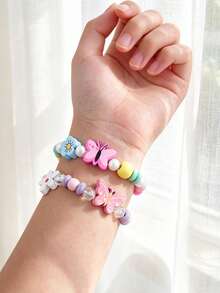 Set di 3 braccialetti in perline di legno con unicorno e farfalla per bambini, braccialetti elastici con ciondoli floreali arcobaleno, gioielli carini a tema cartoni animati, regali di amicizia per ragazze - Multicolore - Visualizzare 5