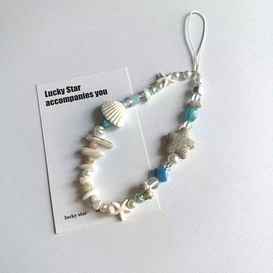 Cordón para teléfono estilo isla con conchas naturales & estrella de mar, fragmentos de conchas naturales seleccionados, estrella de mar de piedra porosa combinada con cuentas de esmalte azul & perlas falsas, textura de playa natural. Enhebrado a mano estilo vintage casual, adecuado para teléfonos, llaves & bolsos de hombro, ambiente de vacaciones, accesorio fresco de nicho de verano, creando un estilo relajado de playa - Celeste - Ver 1