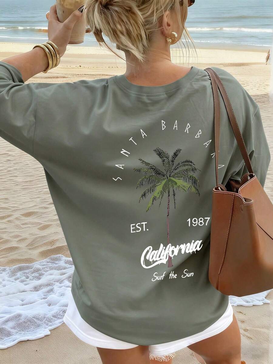 Camiseta de manga corta estilo vacaciones para mujer, con cuello redondo y estampado de palmeras y letras, en blanco, rosa y negro, para verano. - Verde - Ver 1