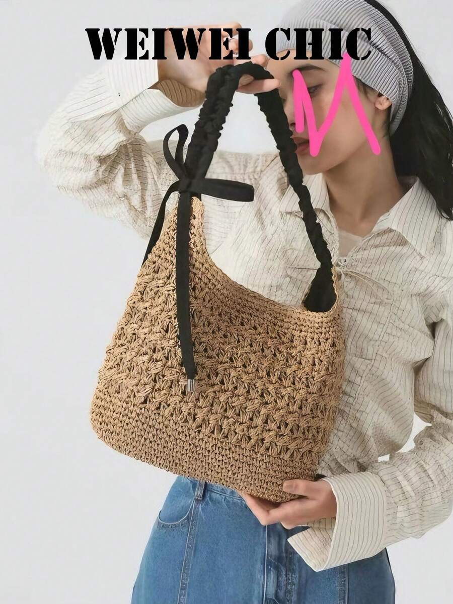 Bolso de hombro de paja con ganchillo hueco color caqui casual con correa de tela plisada negra y decoración de lazo lateral. Textura tejida hueca transpirable y silueta de media luna relajada, creando un ambiente casual de playa, ideal para paseos por la playa, turismo de verano y combinar con atuendos de lino. - Negro - Ver 1