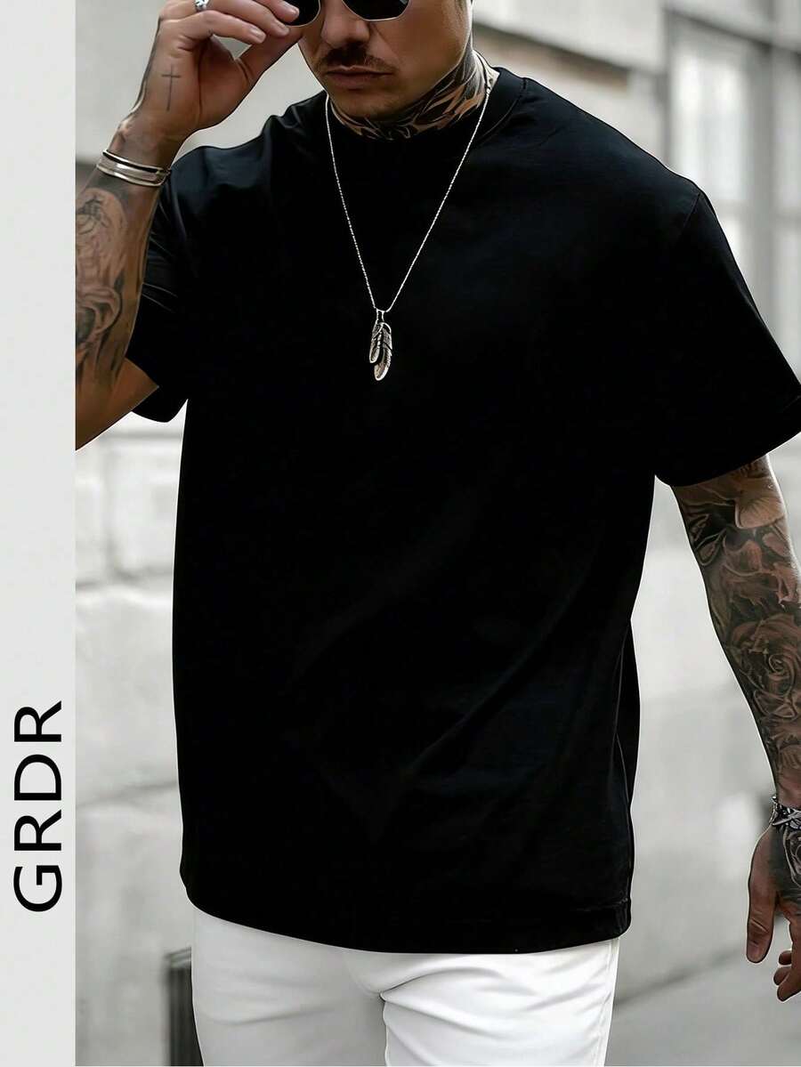 Camiseta de manga corta con cuello redondo de color sólido minimalista y a la moda para hombre, adecuada para uso diario informal. LEDI - Negro - Ver 1