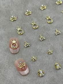10pcs/Bag Gold Glitter Crown Nail Art Charms, Ring-Shaped Hollow Metal Crown, Suitable For Nail Decoration, Nail Art Supplies - Gold - View 1