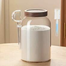 1個罐子和1把湯匙。這款高硼矽玻璃罐容量大達3800ml，透明設計方便觀察內容物，附木製密封蓋，確保優異的密封性能。 - 彩色 - 查看 1