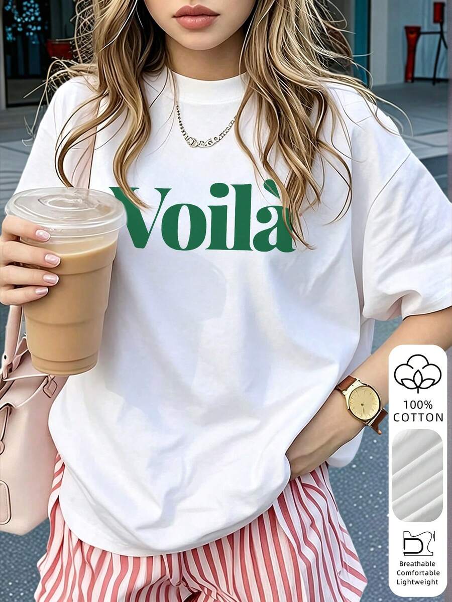 Questa maglietta girocollo in 100% puro cotone presenta una grafica audace con la scritta "Voilà". Stile francese elegante, morbida e traspirante, perfetta per appuntamenti, uscite e uso quotidiano.