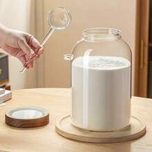 1個罐子和1把湯匙。這款高硼矽玻璃罐容量大達3800ml，透明設計方便觀察內容物，附木製密封蓋，確保優異的密封性能。 - 彩色 - 查看 9