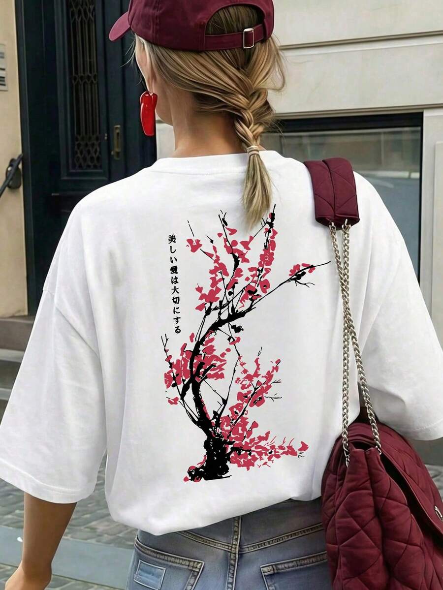 女款粉色圓領梅花印花T恤，寬鬆休閒風，適合日常穿搭與夏季度假，白色