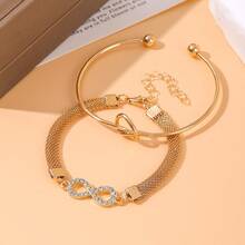 Bộ 2 vòng tay nữ dây xích lưới đính đá rhinestone hình nút thắt trái tim và biểu tượng vô cực - Bộ 2 món hình số 8 đính đá hình trái tim thắt nút màu vàng. - Xem 4