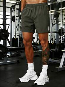 Pantalones cortos deportivos casuales holgados de alto rendimiento para hombre, de secado rápido, unicolor, con diseño de franja reflectante, bolsillos, cremallera y cordón en la cintura - Verde Oscuro - Ver 3
