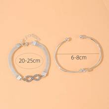 Juego de 2 pulseras para mujer con cadena de malla, símbolo de infinito con nudo de corazón y strass - Juego de 2 piezas de nudo de corazón plateado en forma de ocho - Ver 2
