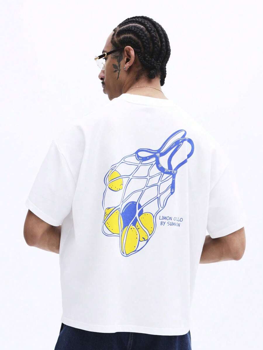 Camiseta de manga corta con cuello redondo y corte holgado para hombre , con estampado de bolsa de malla grande con diseño de limón en la espalda y logotipo frontal, camiseta casual de - Negro - Ver 1