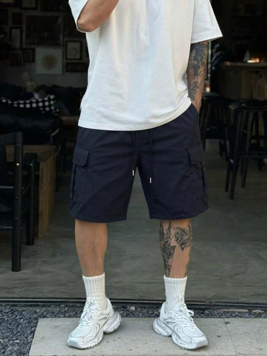 Pantaloncini cargo da uomo per sport all'aperto in tessuto intrecciato, vestibilità ampia con vita con coulisse, design con tasche multiple e patta, pantaloncini casual da streetwear e trekking - nero - Visualizzare 1