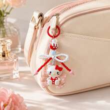MINISO Sanrio Hello Kitty 紅色蝴蝶結串珠鑰匙圈，可愛角色迷你公仔包飾吊飾，附粉色波點蝴蝶結吊墜、紅白珍珠珠蝴蝶結掛繩、星星吊飾與紅色圓環，背包手提包配件，開學禮物 - Red - 查看 2