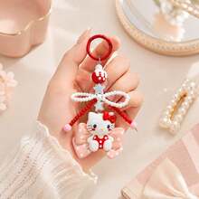 MINISO Sanrio Hello Kitty 紅色蝴蝶結串珠鑰匙圈，可愛角色迷你公仔包飾吊飾，附粉色波點蝴蝶結吊墜、紅白珍珠珠蝴蝶結掛繩、星星吊飾與紅色圓環，背包手提包配件，開學禮物 - Red - 查看 1