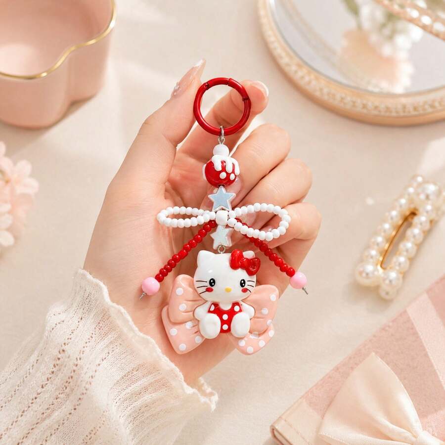 MINISO Sanrio Hello Kitty 紅色蝴蝶結串珠鑰匙圈,可愛角色迷你公仔包飾吊飾,附粉色波點蝴蝶結吊墜、紅白珍珠珠蝴蝶結掛繩、星星吊飾與紅色圓環,背包手提包配件,開學禮物 - Red - 查看 1
