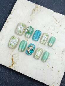 10片装，薄荷蓝，短梯形，按压式美甲贴纸，手工制作，优雅设计，高端法式风格，凝胶抛光，闪亮效果，猫眼效果，金属光泽，全覆盖假指甲，镶嵌各种3D水钻，包含1管果冻凝胶、1个按压式美甲贴纸和1条抛光条。适合派对、旅行、跳舞、日常佩戴，也是送给朋友的绝佳礼物，女士美甲用品，可重复使用。 - 薄荷藍 - 查看 6