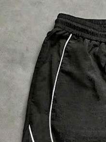 1 pieza Pantalones jogger de nailon texturizado para adolescentes, cintura con cordón, ajuste holgado, diseño de bloques de color lateral, ropa casual de calle para uso diario - Negro - Ver 4