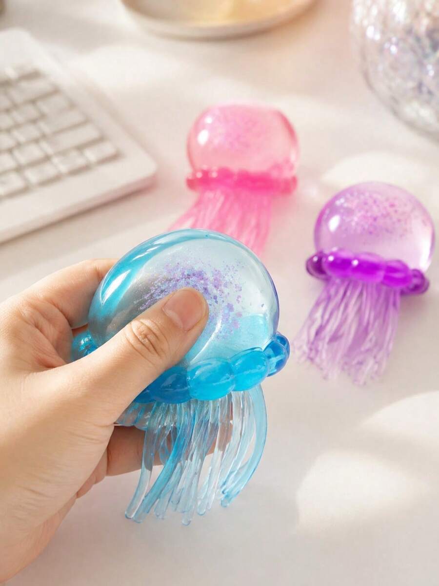 Ny Jelly Squeeze Glitter Jellyfish mjuk gummileksak, ultrastark klämbar sensorisk stresslindrande leksak, högkvalitativt mjukt elastiskt hållbart geléliknande transparent material, kontorsavkoppling, squishy sak. Examenspresent, present till kvinnliga och manliga vänner, denna stresslindrande leksak kan hjälpa dig att minska stress i vardagen, lämplig för spel och festfavoriter, även som present eller festfavorit