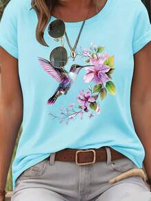 Playera cómoda de manga corta para mujer, diseño holgado con estampado de flores y colibríes, ideal para exteriores, transferencia térmica creativa, tallas XS a XXL - Azul claro - Ver 1