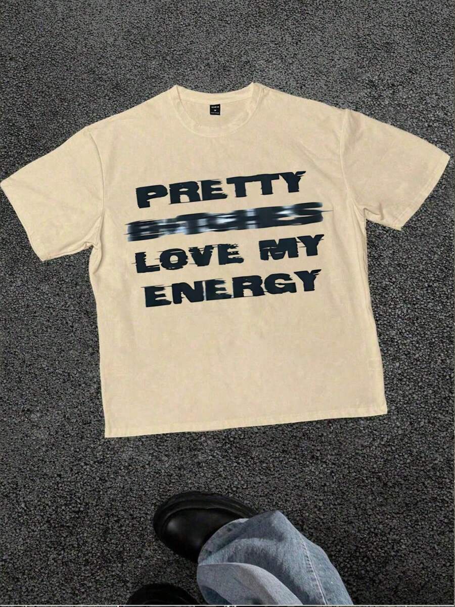 Camiseta Positive Vibe, con la frase 'PRETTY GIRLS LOVE MY ENERGY', diseño casual, suave, de manga corta, 100% algodón, 220 g/m². - Albaricoque - Ver 1