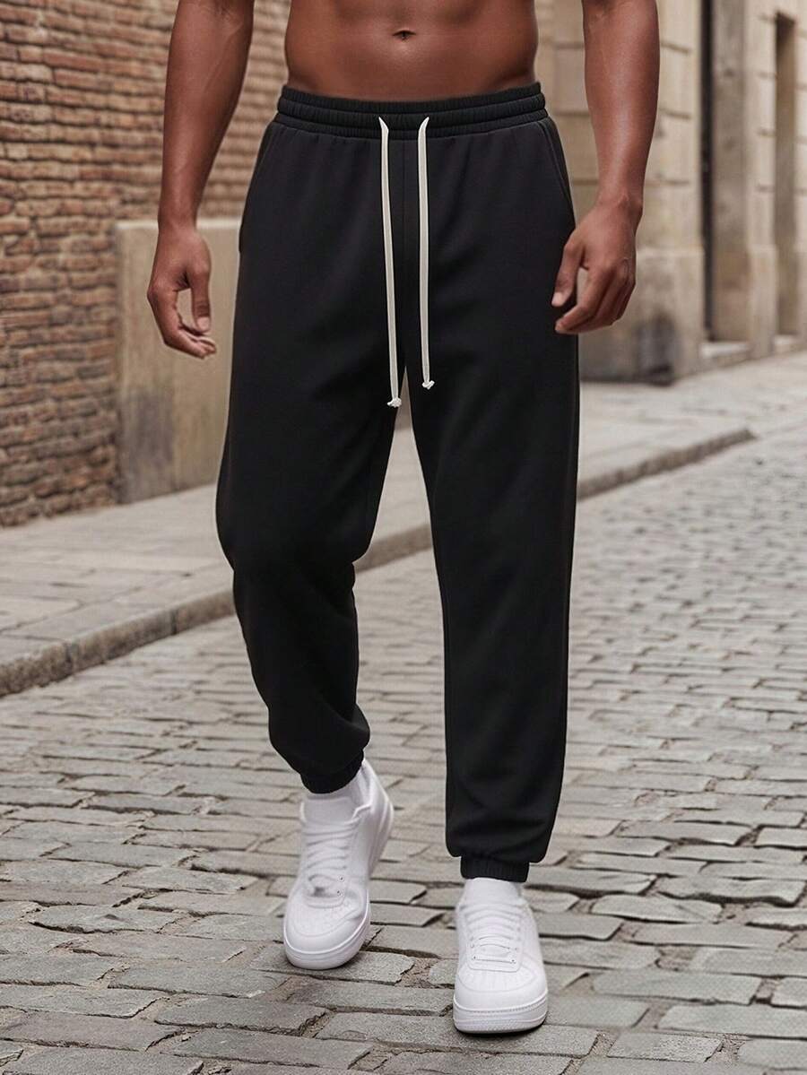 Solid Color All-Match Jogger Sweatpants For Men, Drawstring Elastic Waist Loose Fit Tapered Leg Versatile Casual Sports Long Pants - Black - View 1