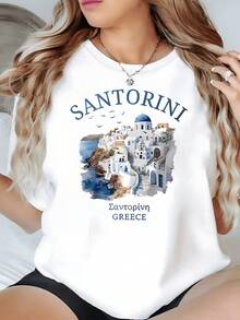 Paisaje costero de Santorini con casas blancas y cúpulas azules sobre el mar Mediterráneo camiseta de mujer casual con motivo veraniego y aire griego elegante - Blanco - Ver 1