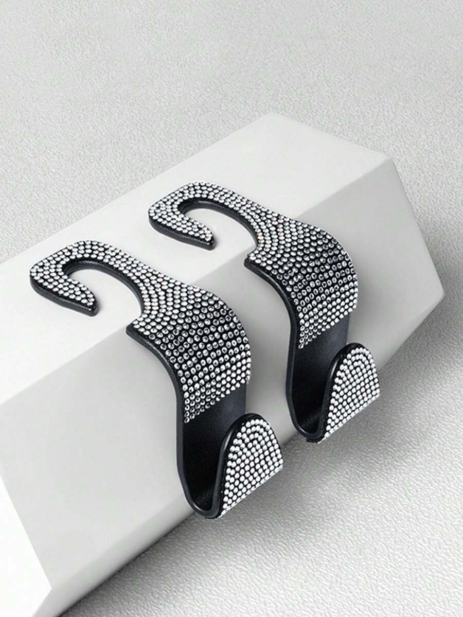 2 piezas Ganchos para respaldo de asiento de coche con colgante de strass, ganchos ocultos creativos para el respaldo del asiento trasero, ganchos colgantes para el interior del coche - Blanco y Negro - Ver 1