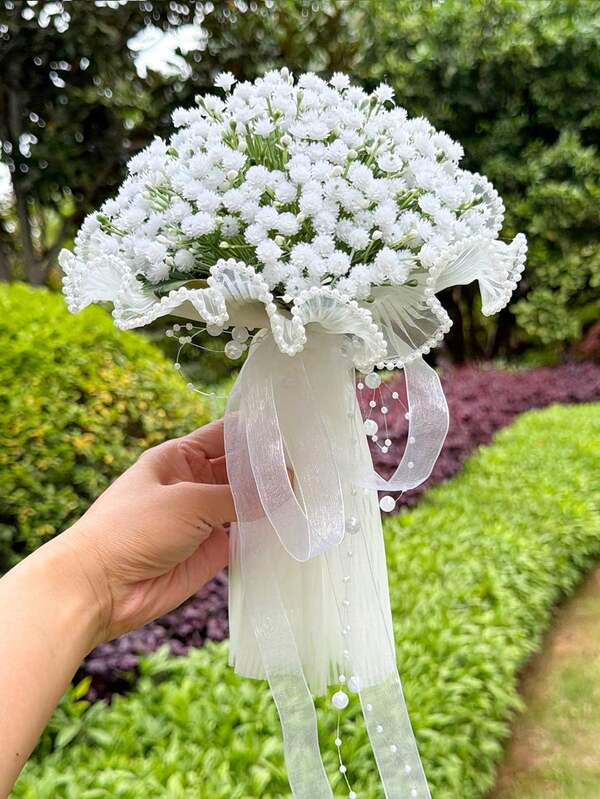 An Elegant White Starry Sky Bouquet For A Wedding, And A Simple Wedding Bouquet For The Bridesmaid, Adorned With Tulle Ribbons And Pearls