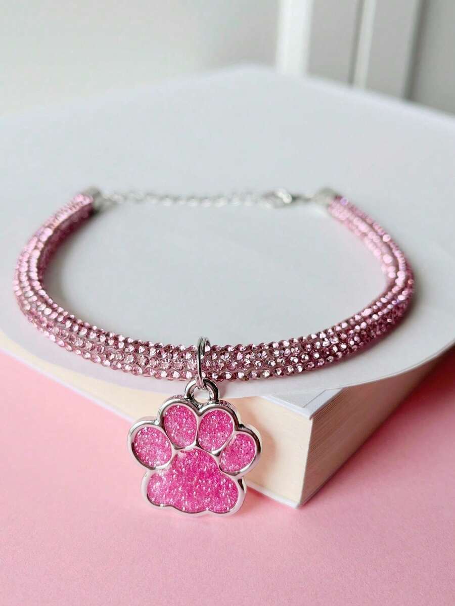 1 pieza Collar con colgante de huella de pata, uso cómodo y ajustable, colgante de aleación con gota de aceite engarzado en garra, cadena de tubo redondo con strass brillante, lujoso y casual, exquisito y versátil, adecuado para gatos y perros - Rosa - Ver 1