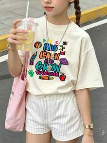 返校季卡通鉛筆書本蘋果標語前印花寬鬆大尺寸T恤，青少年女孩落肩圓領校園短袖上衣 - 杏色 - 查看 8