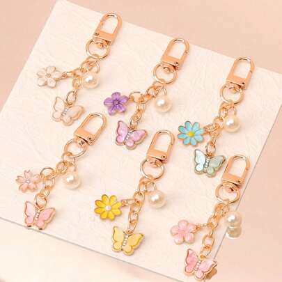 1 pieza Llavero colgante de mujer de acrílico con mariposa de strass de colores, flor de cerezo, margarita y perla falsa, para bolso y llaves