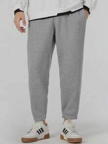 Pantalones deportivos de punto adidas para hombre, cómodos y suaves, de color liso y tiro medio, color gris. - Gris - Ver 1