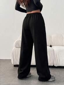 Pantalones deportivos casuales de estilo coreano para mujer Sulojter, unicolor, con bolsillos y cordón, estilo universitario - Negro - Ver 4