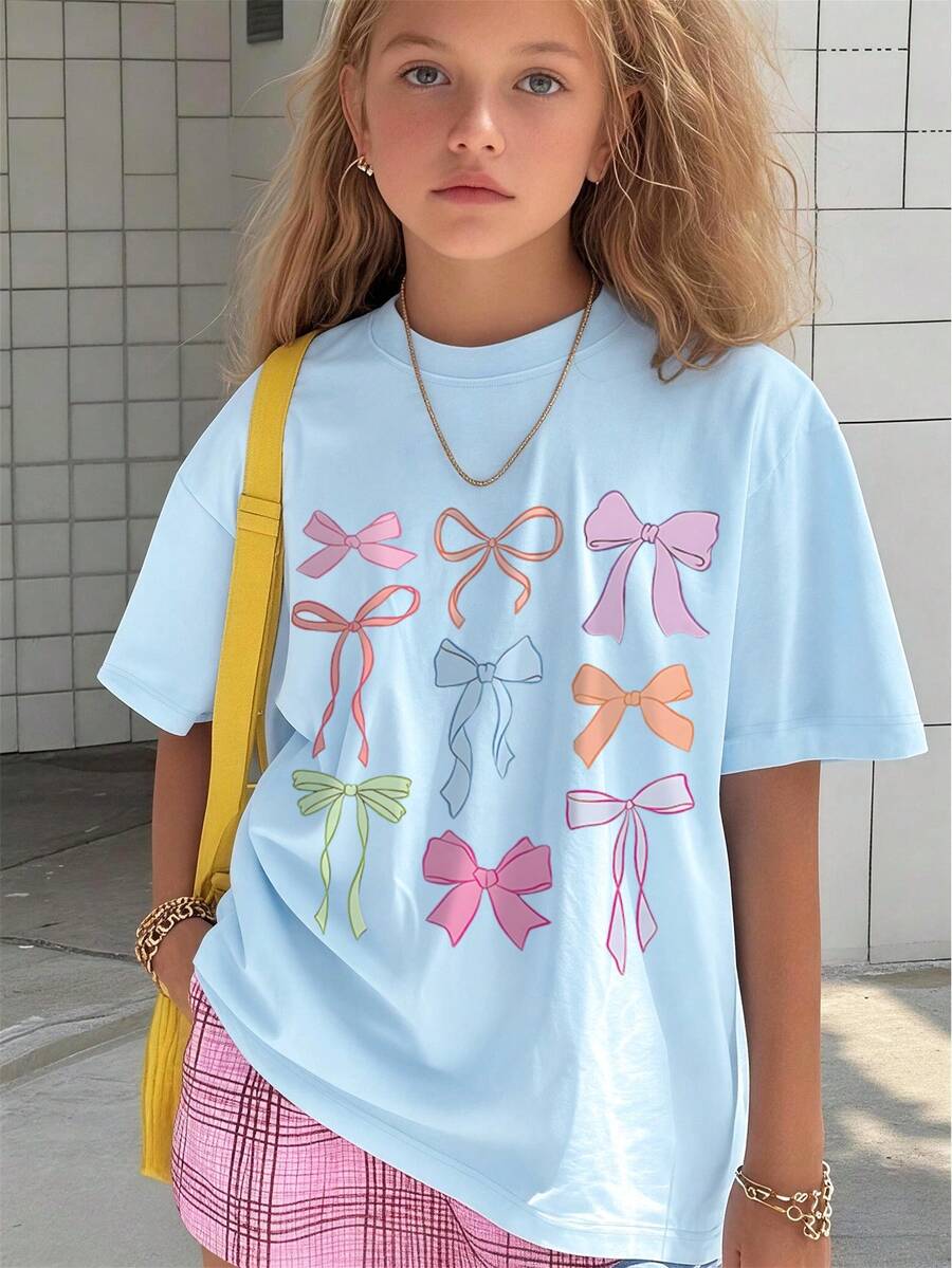Camiseta de cuello redondo con estampado de lazo para niñas preadolescentes, top casual suave para primavera/verano - Celeste - Ver 1