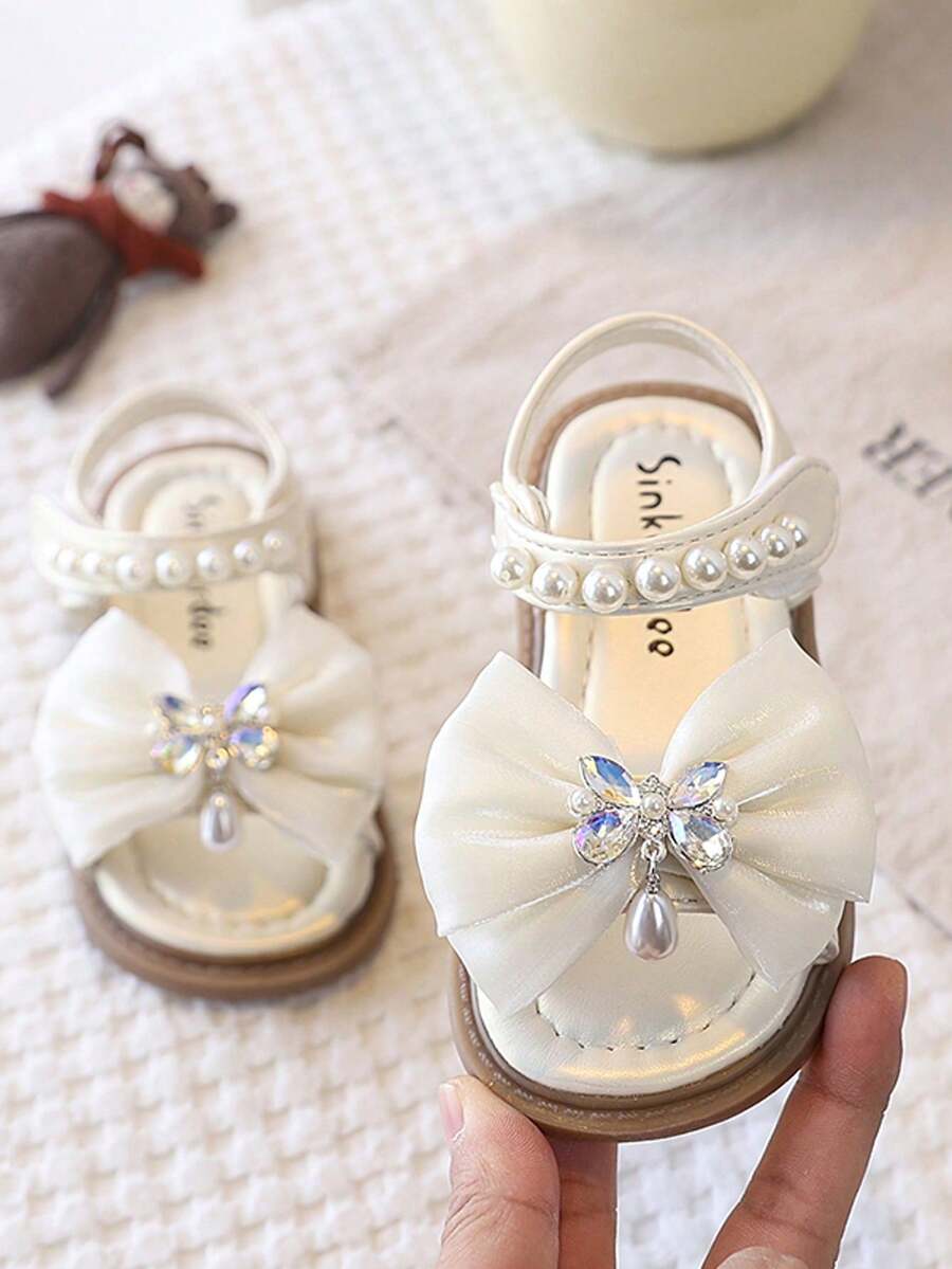 Sandal Anak Perempuan Musim Panas 2025 Gaya Korea Baru Sol Lembut Sepatu Performa Serbaguna Sepatu Putri Anak Sepatu Putri Ujung Bulat - Krem - View 1