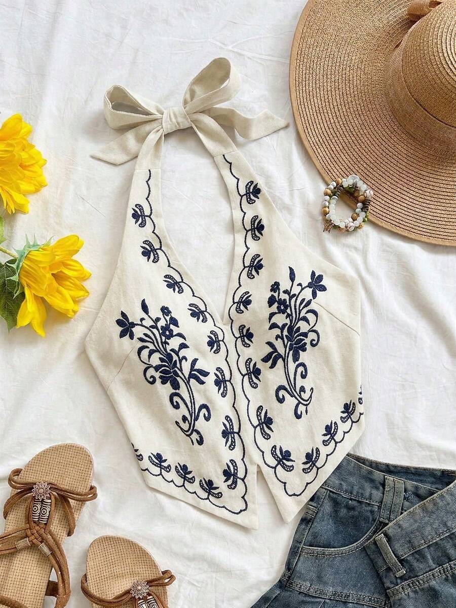 Top corto con cuello halter, espalda descubierta y lazo, con bordado floral sobre base color albaricoque, adecuado para festivales de música - Azul marino - Ver 1