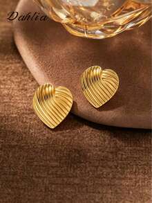 A Pair Of Gold Heart-Striped Earrings, Made Of Stainless Steel. The Elegant Heart-Striped Design Makes These Hypoallergenic Stainless Steel Earrings A Perfect Gift For A Female Friend, Ideal For A Teacher Or Other Female Jewelry Enthusiast. - Gold - View 1