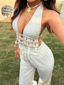 Conjunto de dos piezas con top halter de cuello en V profundo y textura arrugada en color albaricoque, y pantalones rectos de cintura baja. - Negro - Ver 5